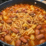 Mexican noodle soup with ground beef potatoes and pinto beans